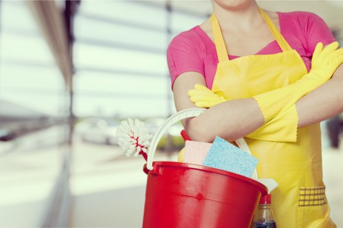 Technician cleaning a built-in oven in Hounslow with care