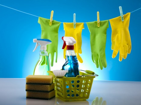 Cleaner working through shared office spaces and washrooms in Hounslow